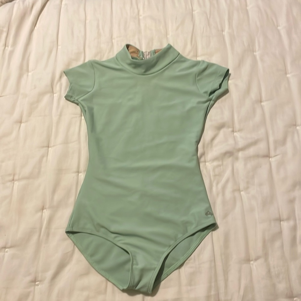girls leotard mint green worn a few times (costume) but wears like a regular!